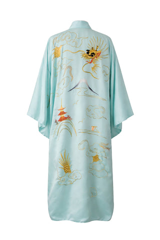 Light blue robe with intricate gold embroidery on a white background