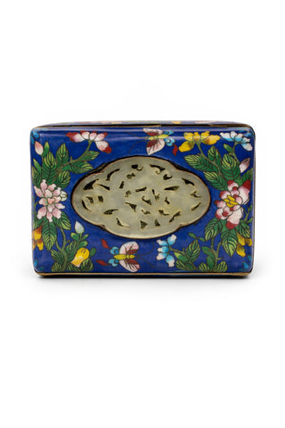 Blue Clossione box with floral and butterfly design on a blue background.