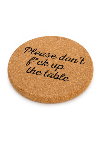 Cork coaster with humorous text on a white background