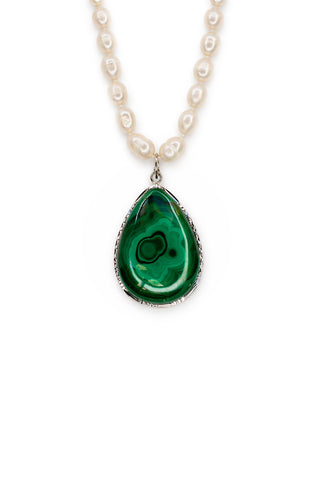 Teardrop-shaped green malachite pendant on a white pearl necklace against a white background