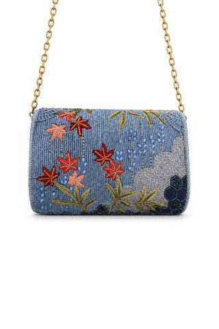 Beaded clutch bag with floral patterns on a white background