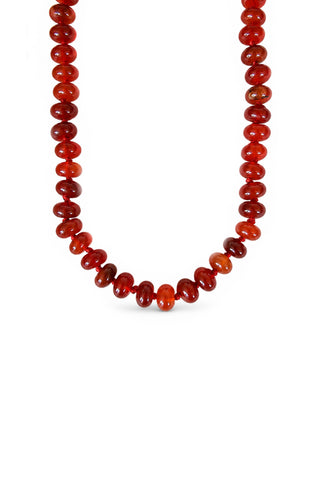 Necklace with red carnelian beads on a white background