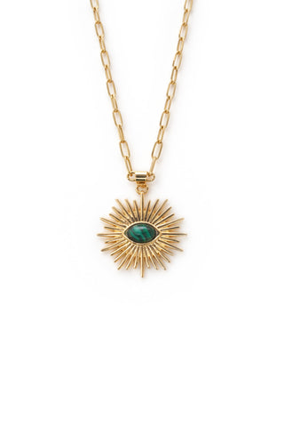 Gold necklace with a sunburst pendant featuring a green malachite gemstone on a white background
