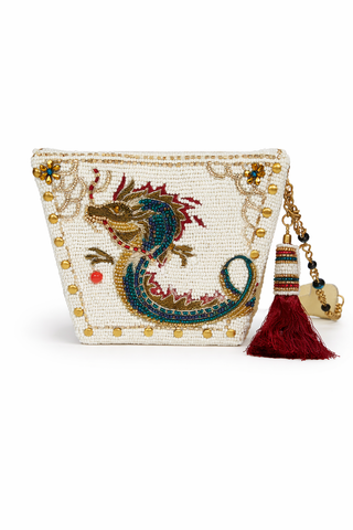 Take away box style beaded purse with dragon design and tassel on a white background