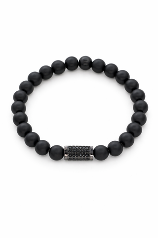 Black matte beaded bracelet with a pavé bead on a white background
