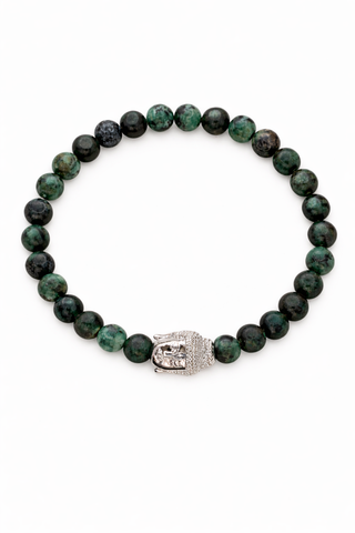 Green beaded bracelet with a silver Buddha charm on a white background