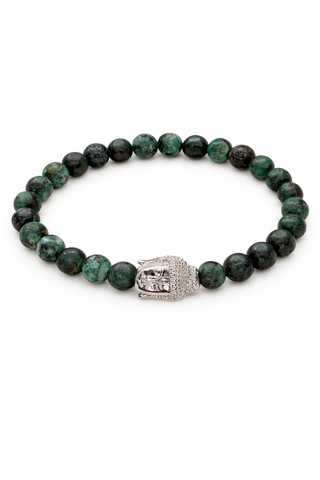 Beaded green tigers eye bracelet with a silver Buddha head charm on a white background