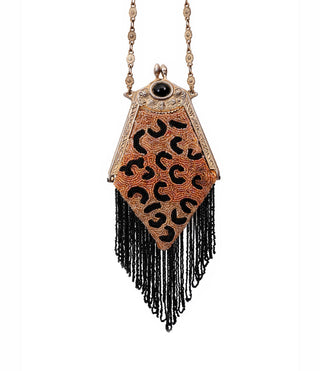 Vintage handbag with beaded leopard design on a white background