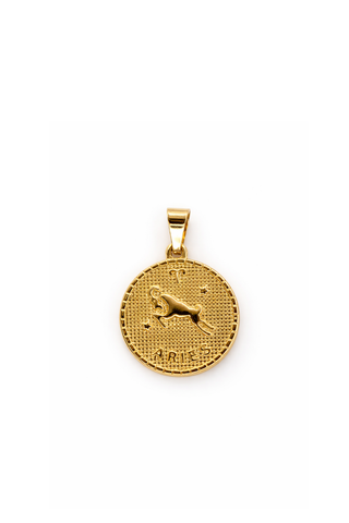 Gold pendant with Aries zodiac design on a white background
