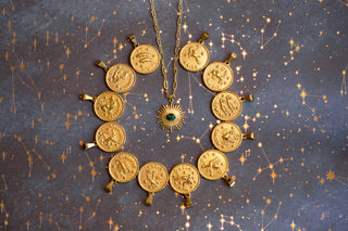 Gold necklace with coin pendants on a starry background